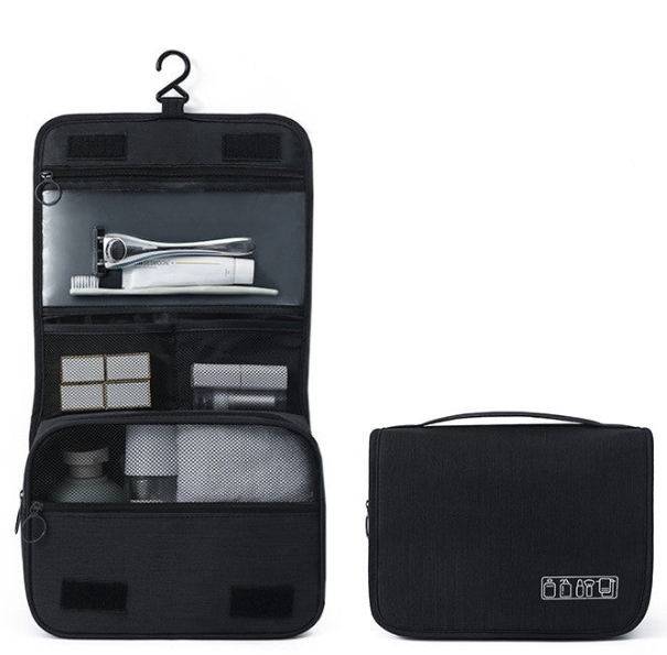 A black hanging toiletry bag shown open on the left and closed on the right against a plain white background. The open view reveals multiple interior compartments with toiletries, and the closed view shows the exterior with a top handle and a small white icon on the lower right.