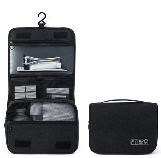 A black hanging toiletry bag shown open on the left and closed on the right against a plain white background. The open view reveals multiple interior compartments with toiletries, and the closed view shows the exterior with a top handle and a small white icon on the lower right.